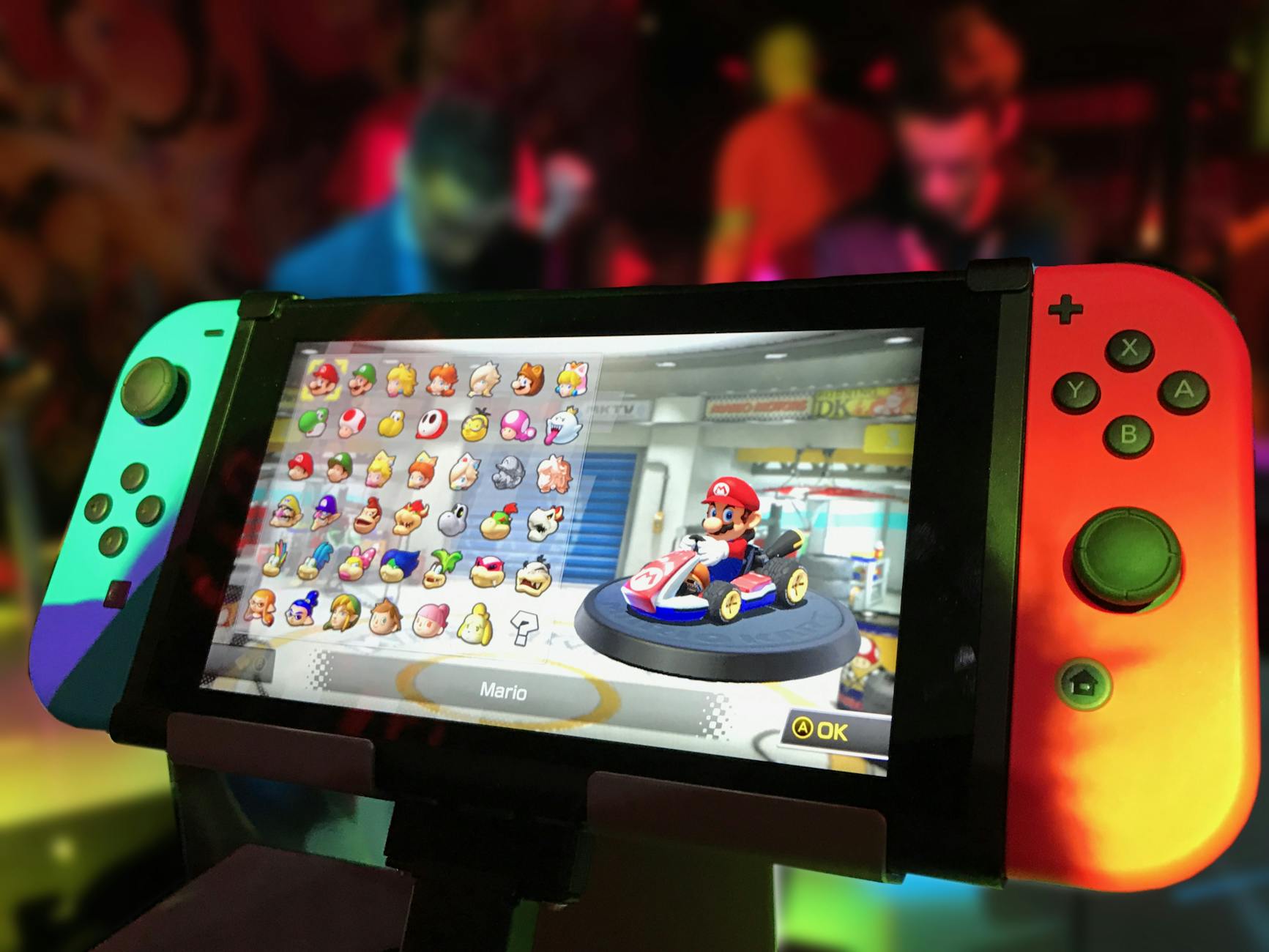 An image of a Nintendo switch with Mario game in-display.